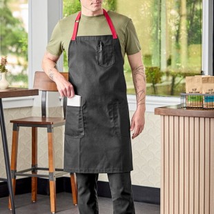 Uncommon Chef 3104 Black Customizable Poly-Cotton Rebel Bib Apron with Red Webbing and 3 Pockets - 34