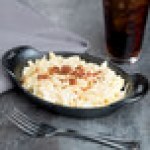 Lodge HM16OS 16 oz. Pre-Seasoned Heat-Treated Mini Cast Iron Oval Casserole Dish