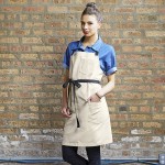 Uncommon Chef 3116 Ivory Customizable 100% Cotton Canvas Aura Bib Apron with Black Webbing and 3 Pockets - 34