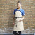 Uncommon Chef 3116 Ivory Customizable 100% Cotton Canvas Aura Bib Apron with Black Webbing and 3 Pockets - 34