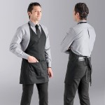 Uncommon Chef 3041 Black Customizable Poly-Cotton Twill V-Neck Tuxedo Apron with Adjustable Neck Strap and 2 Pockets - 28