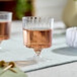 WNA Comet CCW5240 Classicware 5 oz. 1-Piece Clear Plastic Pedestal Wine Cup - 10/Pack WNA Comet CCW5240 Classicware 5 oz. 1-Piece Clear Plastic Pedestal Wine Cup - 10/Pack
