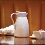 Service Ideas Twist 'N' Serv 20.2 oz. White Plastic Insulated Coffee Carafe / Server with Push-Button Lid TNSPB06WH