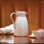 Service Ideas Twist 'N' Serv 20.2 oz. White Plastic Insulated Coffee Carafe / Server with Push-Button Lid TNSPB06WH