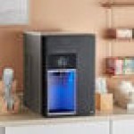 Follett 15CI114A-IW-NF-ST-00 Champion 15 Series Air-Cooled Chewblet Countertop Ice Maker and Water Dispenser with 15 lb. Bin - 115V, 100 lb.