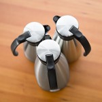 Service Ideas Slim Server 50.7 oz. Stainless Steel Insulated Light Weight Coffee Carafe / Server with Black Push-Button Lid 83715