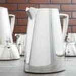 Vollrath 46206 Triennium 73.6 oz. Mirror-Finished Stainless Steel Water Pitcher with Ice Guard