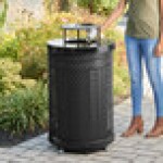 Lancaster Table & Seating 36 Gallon Heavy-Duty Round Black Expanded Steel Outdoor Trash Can with Rain Bonnet Lid