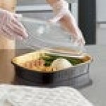 Choice Heavy Duty Smoothwall Black and Gold Large Oblong Foil Entree / Take-Out Pan with Dome Lid 65.6 oz. - 10/Pack