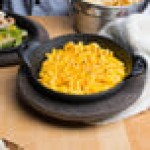 Lodge 14 oz. Pre-Seasoned Heat-Treated Mini Cast Iron Round Casserole Dish with Walnut Wood Underliner