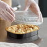 Choice Heavy Duty Smoothwall Black and Gold Small Oblong Foil Take-Out Pan with Dome Lid 23.3 oz. - 100/Case Choice Heavy Duty Smoothwall Black and Gold Small Oblong Foil Take-Out Pan with Dome Lid 23.3 oz. - 100/Case