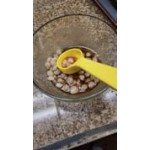Carlisle 496101 Measure Misers 1.5 oz. Reddish Brown Acetal Short Handle Perforated Portion Spoon