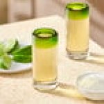 Acopa Tropic 3 oz. Shooter Glass with Green Rim - Sample