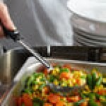 Vollrath 61170 4 oz. Black Perforated Round Stainless Steel Spoodle® Portion Spoon with Grip 'N Serve® Handle