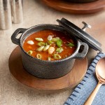 Valor 8 oz. Pre-Seasoned Mini Cast Iron Pot with Rustic Chestnut Finish Rubberwood Underliner