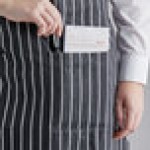Choice Black and White Poly-Cotton Chalk Stripe Standard Bib Apron with 2 Pockets - 34