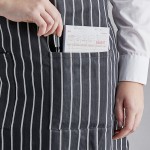 Choice Black and White Poly-Cotton Chalk Stripe Standard Bib Apron with 2 Pockets - 34