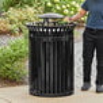 Lancaster Table & Seating 45 Gallon Heavy-Duty Round Black Steel Slatted Outdoor Trash Can with Rain Bonnet Lid Lancaster Table & Seating 45 Gallon Heavy-Duty Round Black Steel Slatted Outdoor Trash Can with Rain Bonnet Lid