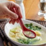 Thunder Group 7200JBR .6 oz. Two-Tone Red and Black Melamine Wonton Soup Spoon - 12/Pack