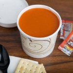 Solo KHSB12A-J8000 Symphony Print 12 oz. Double Poly-Paper Soup / Hot Food Cup with Vented Paper Lid - 250/Case
