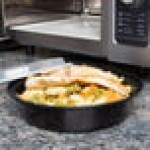 Pactiv Newspring NC737B 35 oz. Black VERSAtainer Round Microwavable Container with Lid - 150/Case