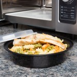 Pactiv Newspring NC737B 35 oz. Black VERSAtainer Round Microwavable Container with Lid - 150/Case