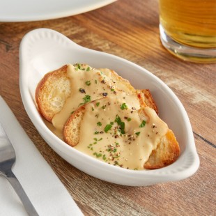 Tuxton BEN-045 4.5 oz. Eggshell Oval China Welsh Rarebit - 12/Case