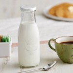 Acopa 14 oz. Embossed Glass Milk Bottle - 12/Case Acopa 14 oz. Embossed Glass Milk Bottle - 12/Case