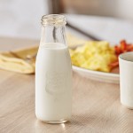 Acopa 14 oz. Embossed Glass Milk Bottle - 12/Case Acopa 14 oz. Embossed Glass Milk Bottle - 12/Case