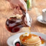 Vollrath 614-01 Dripcut® 14 oz. Glass Syrup Dispenser with Brown Plastic Top