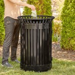 Lancaster Table & Seating 45 Gallon Heavy-Duty Round Black Steel Slatted Outdoor Trash Can with Flat Lid and Door Lancaster Table & Seating 45 Gallon Heavy-Duty Round Black Steel Slatted Outdoor Trash Can with Flat Lid and Door