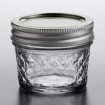 Ball 60000ZFP 8 oz. Half-Pint Regular Mouth Glass Canning Jar with Silver Metal Lid and Band - 12/Case