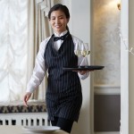 Choice Black and White Pinstripe Poly-Cotton Adjustable Tuxedo Apron with 2 Pockets - 32