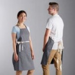 Choice Navy Blue Poly-Cotton Adjustable Bib Apron with 2 Pockets and Natural Webbing Accents - 32