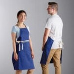 Choice Navy Blue Poly-Cotton Adjustable Bib Apron with 2 Pockets and Natural Webbing Accents - 32