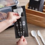 Dinex Black Enjoy Paper Cutlery Caddy with Napkin - 520/Case Dinex Black Enjoy Paper Cutlery Caddy with Napkin - 520/Case