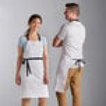 Choice White Poly-Cotton Adjustable Bib Apron with 2 Pockets and Black Webbing Accents - 32 Choice White Poly-Cotton Adjustable Bib Apron with 2 Pockets and Black Webbing Accents - 32