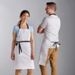 Choice White Poly-Cotton Adjustable Bib Apron with 2 Pockets and Black Webbing Accents - 32 Choice White Poly-Cotton Adjustable Bib Apron with 2 Pockets and Black Webbing Accents - 32