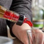 TableCraft 1 oz. Red Spout / Red Tail Measured Liquor Pourer with Collar 2246A - 12/Pack