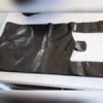 Choice 1/6 Standard Size Black Unprinted Medium-Duty Plastic T-Shirt Bag - 500/Case Choice 1/6 Standard Size Black Unprinted Medium-Duty Plastic T-Shirt Bag - 500/Case
