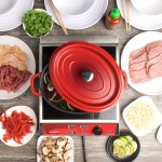 GET CA-009-R/BK Heiss 3.5 Qt. Red Enamel Coated Cast Aluminum Oval Dutch Oven with Lid