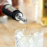 Acopa Stainless Steel Tapered Liquor Pourer with Flip Cap - 12/Pack