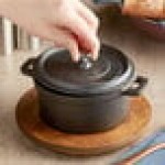Valor 16 oz. Pre-Seasoned Mini Cast Iron Pot with Rustic Chestnut Finish Rubberwood Underliner