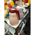 Vollrath 632-18 Dripcut® 32 oz. White Polyethylene Syrup Server with Almond Top