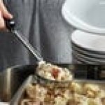 Vollrath 61172 4 oz. Black Solid Round Stainless Steel Spoodle® Portion Spoon with Grip 'N Serve® Handle