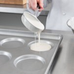 Chicago Metallic 41002 Glazed Aluminized Steel 15 Mold 3.32 oz. Individual Hamburger Bun / Muffin Top / Cookie Pan - 17 3/4