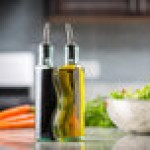 TableCraft Gemelli 8.5 oz. 3-Piece Clear Glass Oil and Vinegar Cruet Set with Stainless Steel Rack - 6/Case TableCraft Gemelli 8.5 oz. 3-Piece Clear Glass Oil and Vinegar Cruet Set with Stainless Steel Rack - 6/Case