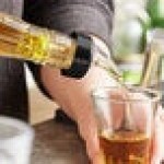 TableCraft 1.5 oz. Clear Spout / Yellow Tail Measured Liquor Pourer with Collar 4249A - 12/Pack