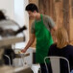 Choice Kelly Green Poly-Cotton Adjustable Bib Apron with 2 Pockets - 32