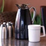 Service Ideas Classy 33.8 oz. Black Powder-Coated Stainless Steel Insulated Coffee Carafe / Server with Push-Button Lid CJZS1BLK